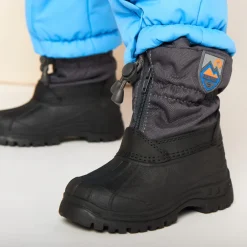 Bicolor zip après-ski met rubberen badge voor babyjongens