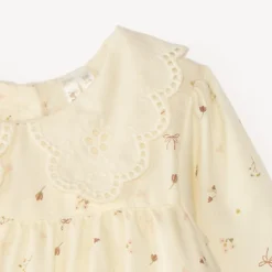 Bloemige jurk voor baby meisje met Engelse borduurrand.