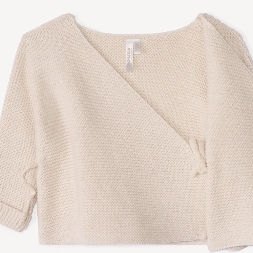 Effen tricot babybustier in mousse ste stitch.