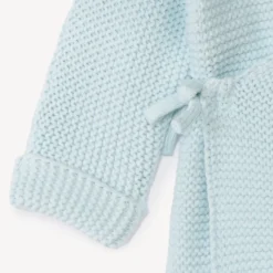 Effen tricot babybustier in mousse ste stitch.