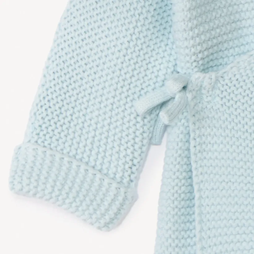 Effen tricot babybustier in mousse ste stitch.