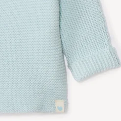 Effen tricot babybustier in mousse ste stitch.