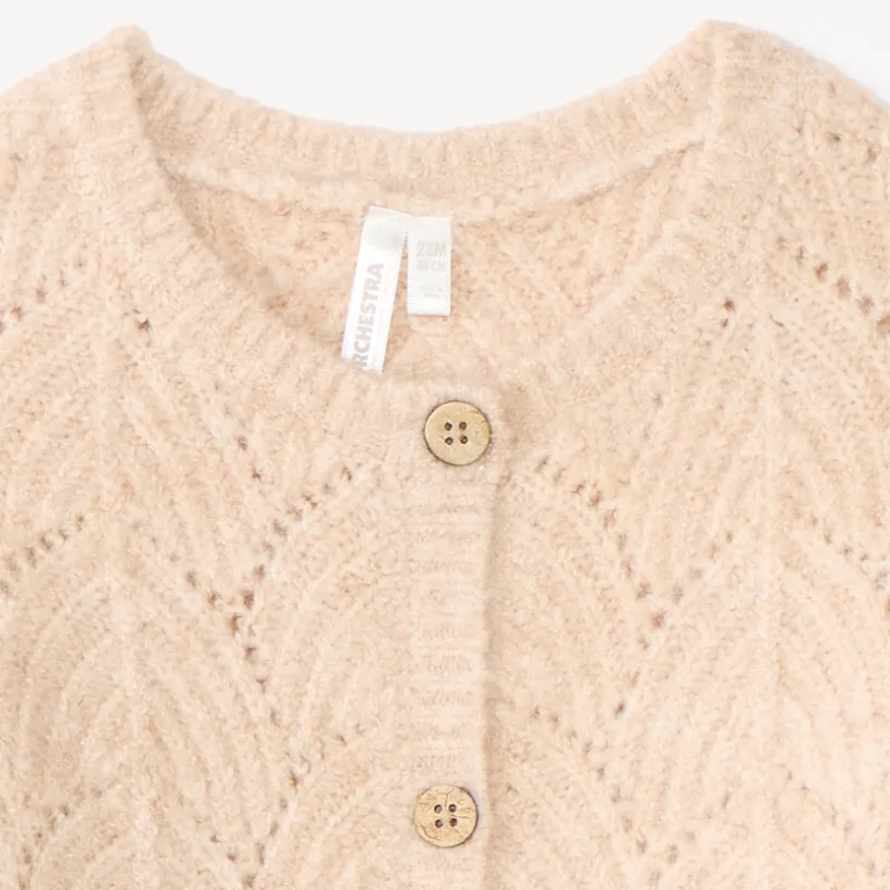 Gebreide meisjes vest met fantasiedetails