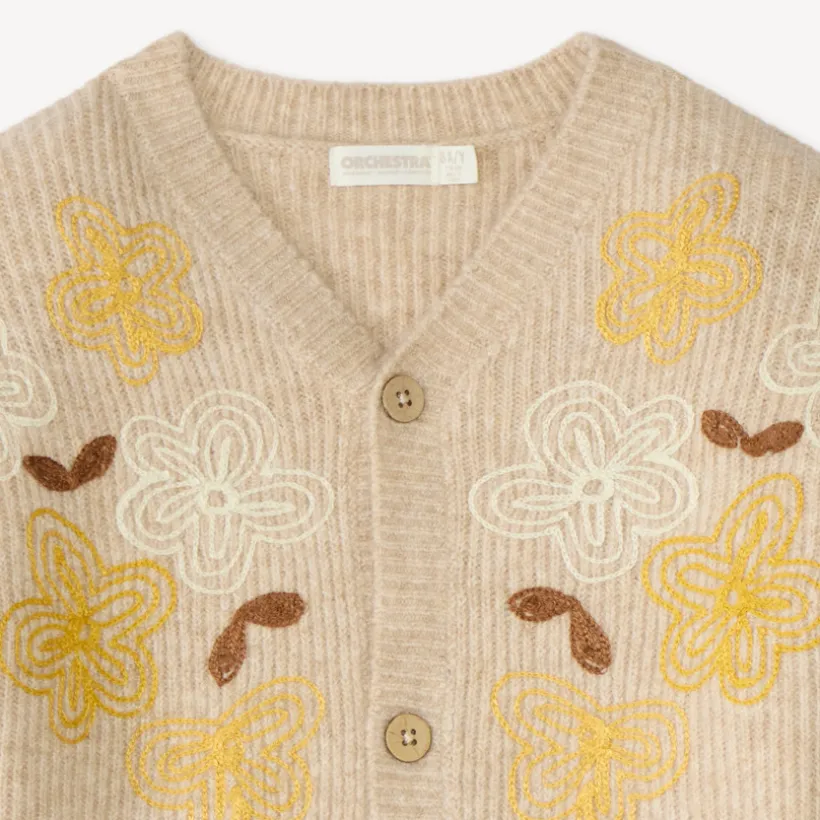 Gebreide meisjesvest met geborduurde bloemen