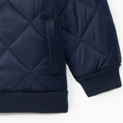 Jas jongens met een waterafstotende quilt.