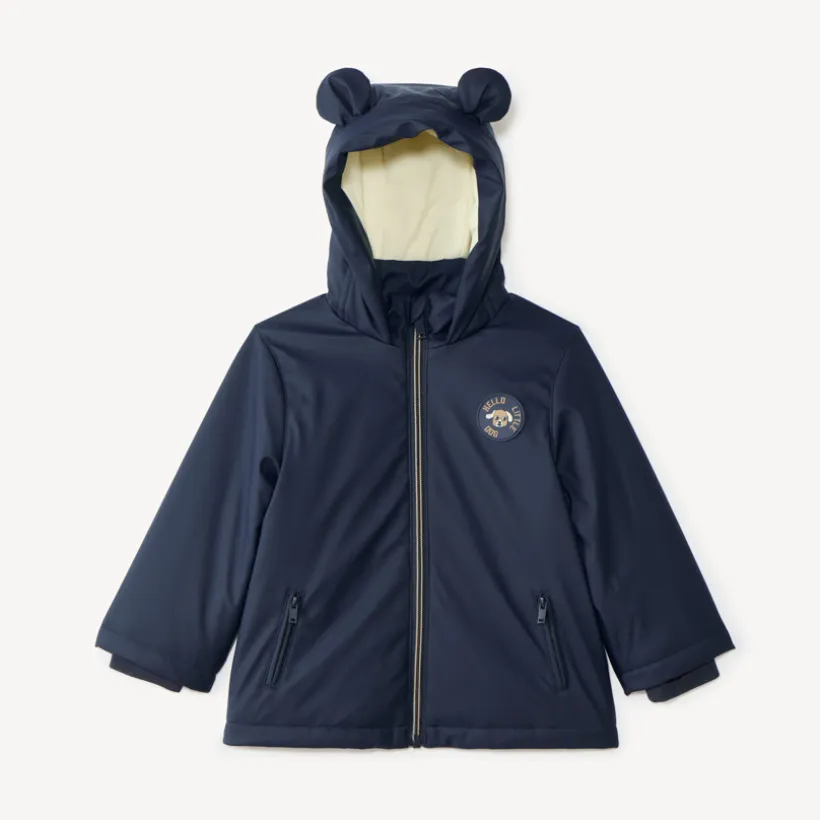 Jas van gum voor babyjongen, gevoerd met microfleece en met een capuchon met oortjes.