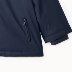 Jas van gum voor babyjongen, gevoerd met microfleece en met een capuchon met oortjes.