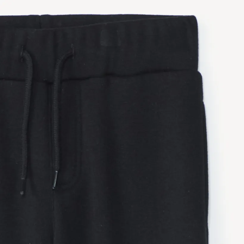 Joggingbroek in effen fleece met sherpa voering jongens