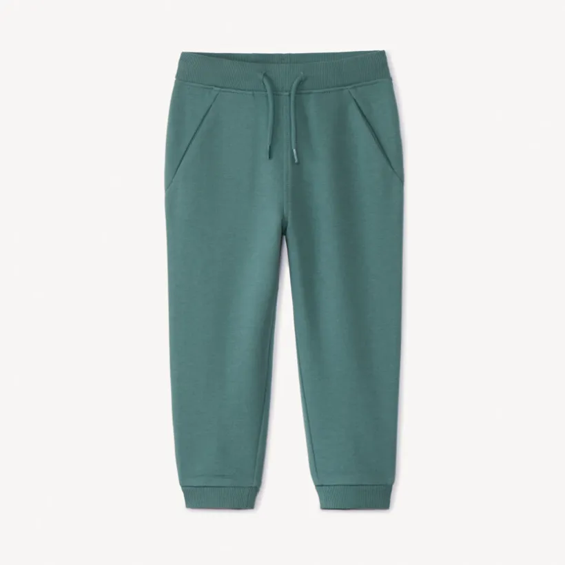 Joggingbroek in effen fleece voor babyjongens met elastische taille en aantrekkoord, twee Italiaanse zakken en aansluitende geribde enkels