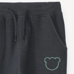 Joggingbroek voor babyjongen van honingraatstof met teddybeerprint