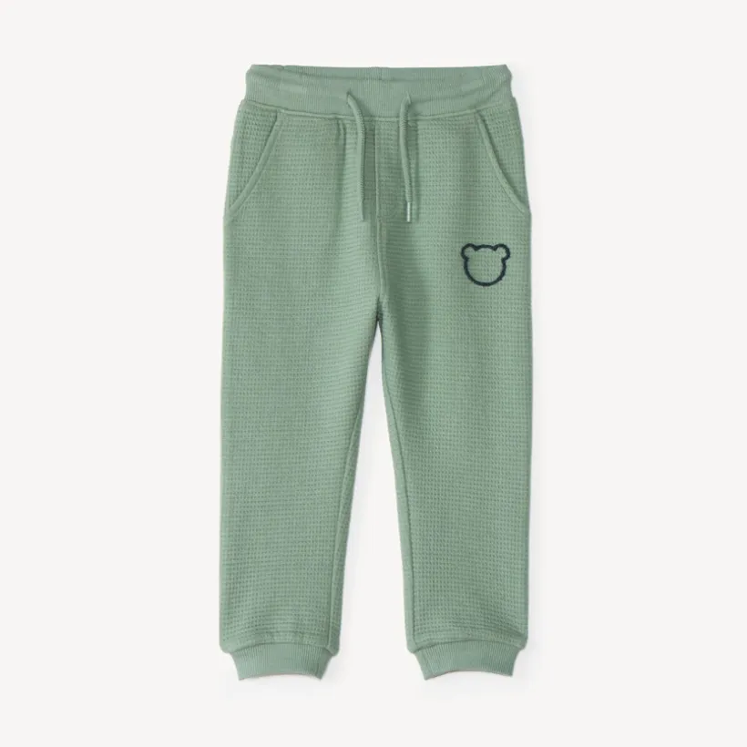 Joggingbroek voor babyjongen van honingraatstof met teddybeerprint