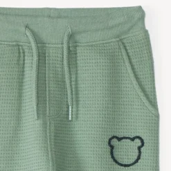 Joggingbroek voor babyjongen van honingraatstof met teddybeerprint