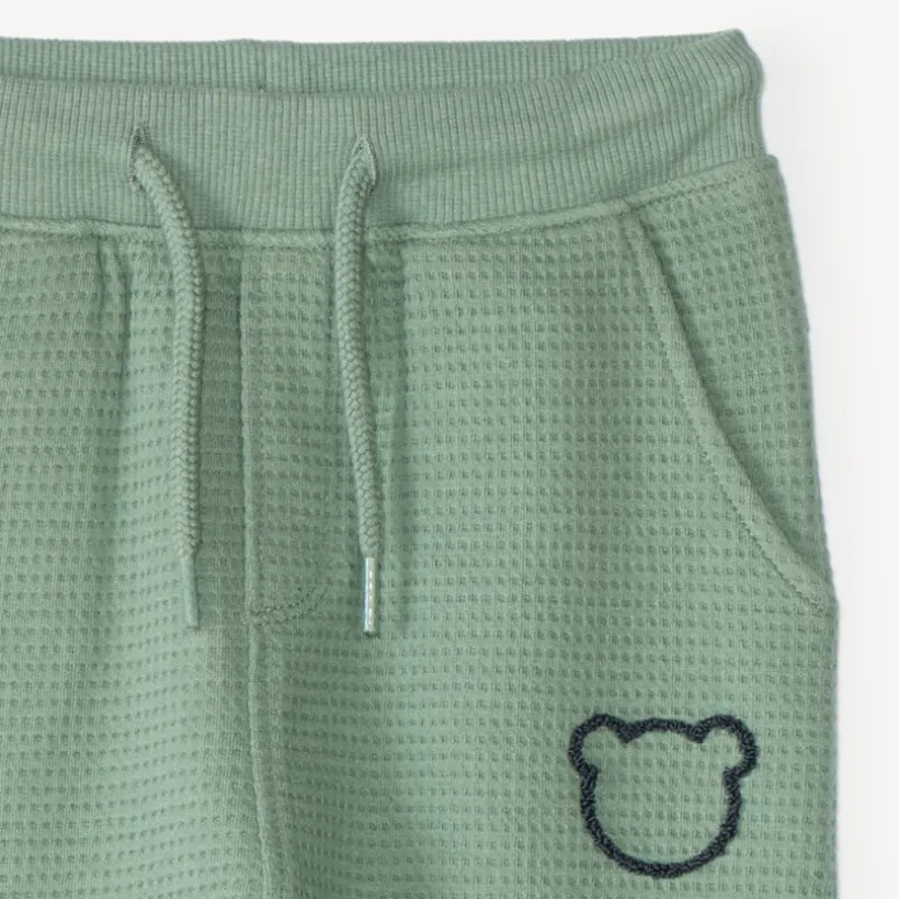 Joggingbroek voor babyjongen van honingraatstof met teddybeerprint