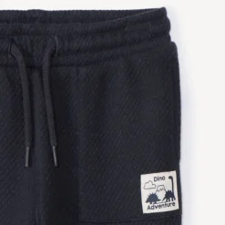 Jogging met effen kleur en label voor babyjongens