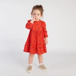 Jurk met lange mouwen, rode serge, allover fantasiehartenprint voor babymeisje