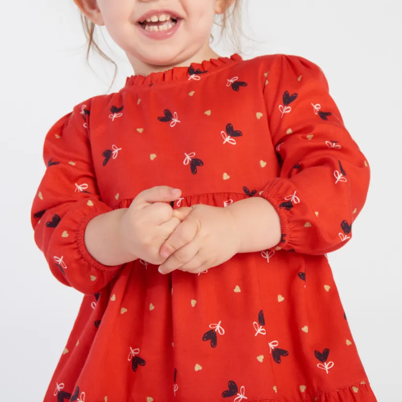 Jurk met lange mouwen, rode serge, allover fantasiehartenprint voor babymeisje