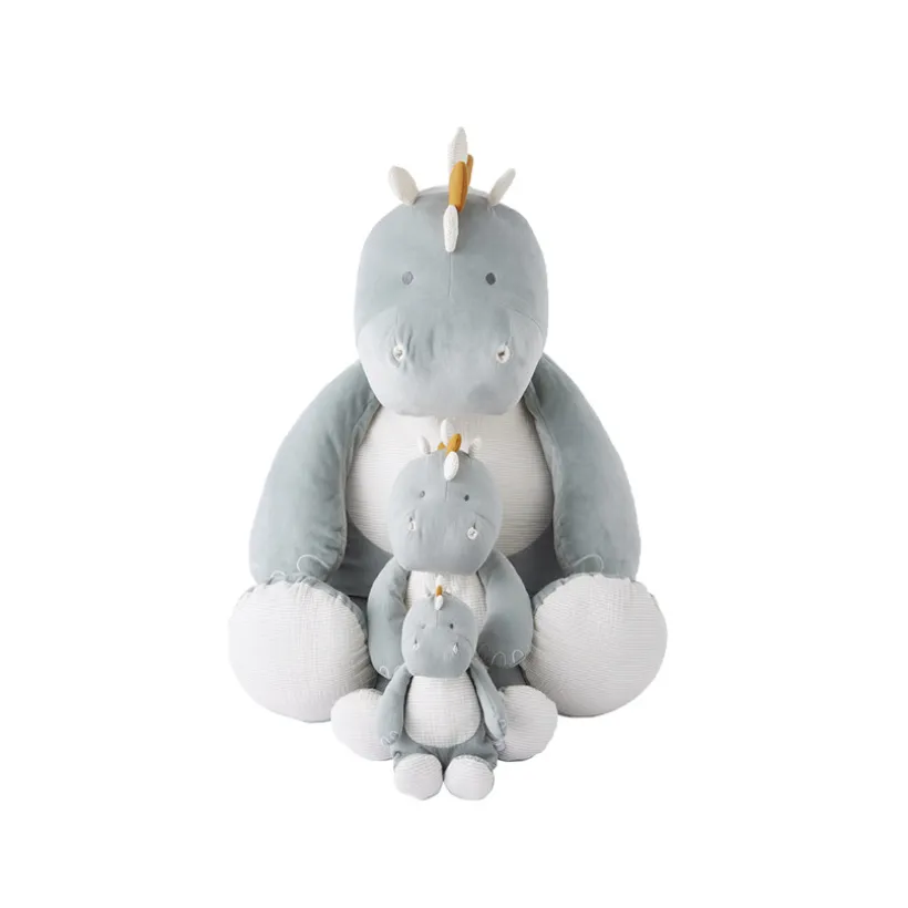 Kleine dino pluche van biologisch katoenen mousseline in eucalyptus kleur