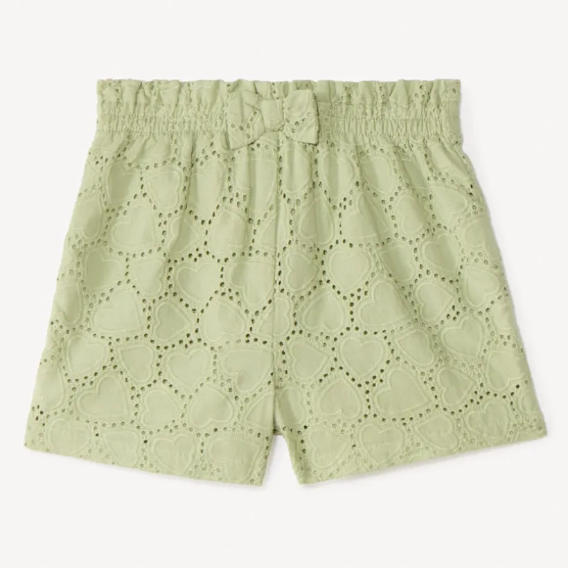 Korte uni met broderie anglaise en een leuke strik voor babymeisjes