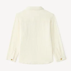 Langarmige babyjongen blouse van dubbele gaze met een fantasiebadge.