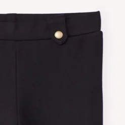 Legging in sergé effen kleur met elastische taille en decoratieve lussen meisjes