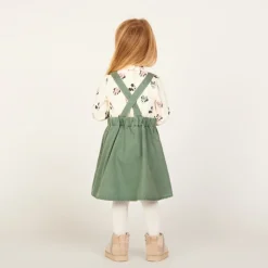 Overgooierjurk met gekruiste bretellen en knoop voor babymeisje