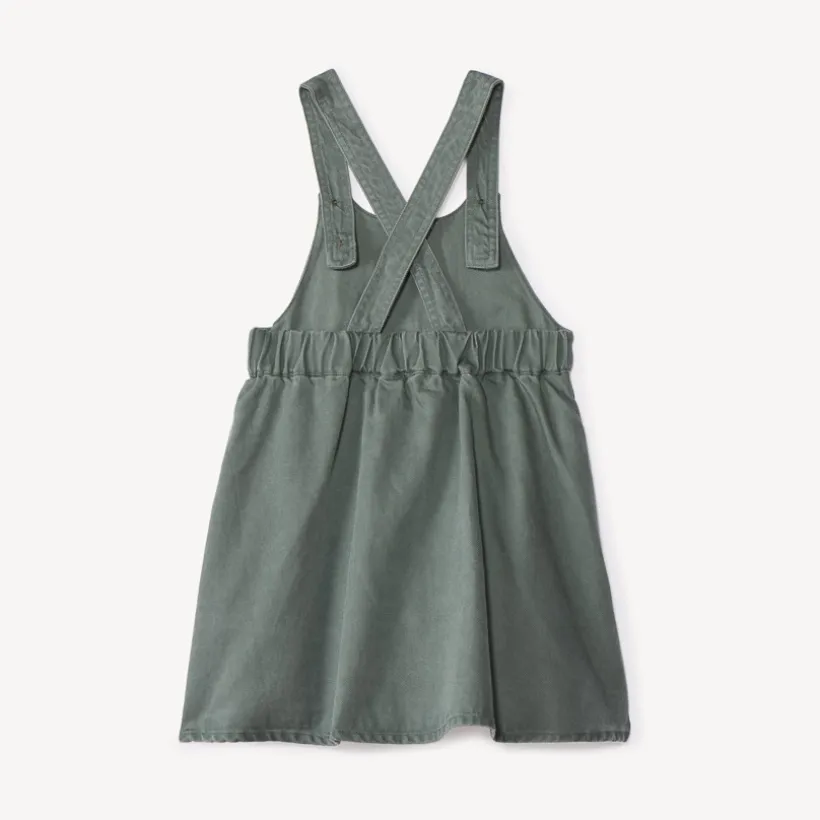 Overgooierjurk met gekruiste bretellen en knoop voor babymeisje