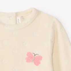 Pyjama in fluweel met verbrand bloemmotief en konijnpatroon voor babymeisje, met verschillende drukknopopeningen naargelang de leeftijd