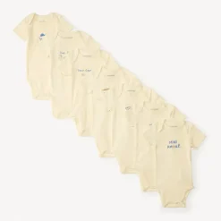 Set van 7 effen baby's rompers met fantasieprint