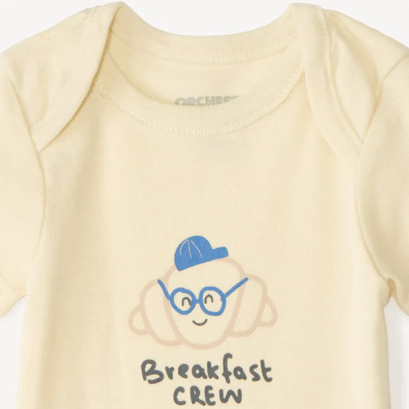 Set van 7 effen baby's rompers met fantasieprint
