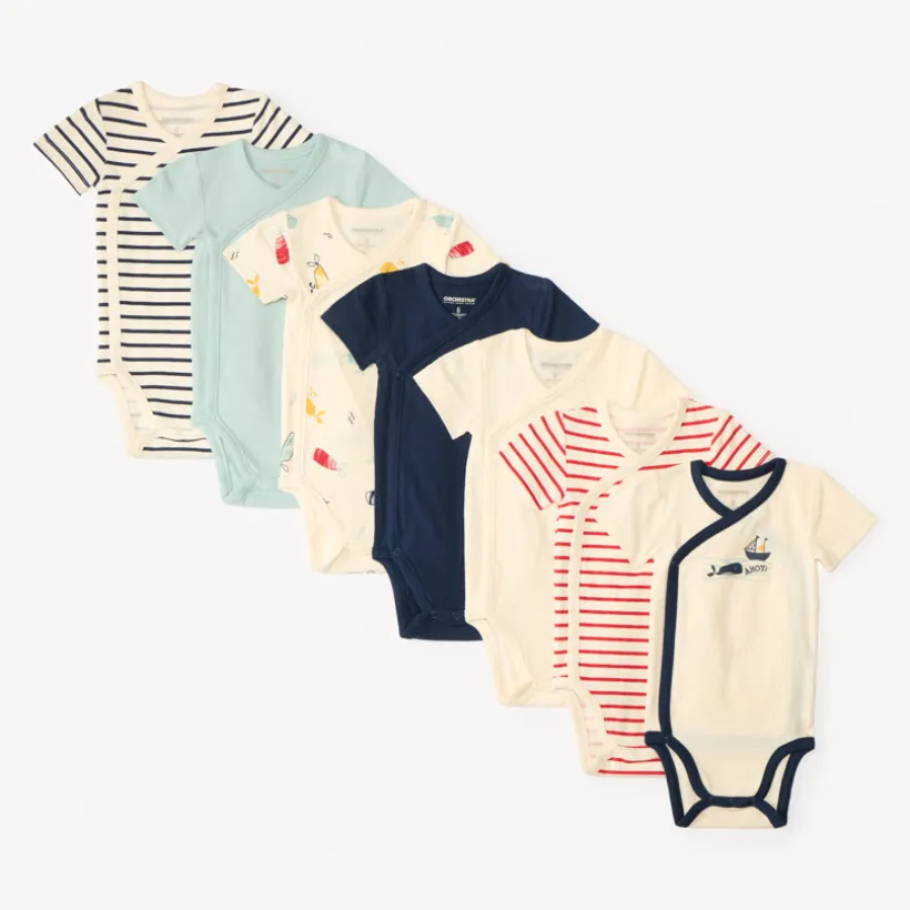 Set van 7 korte mouw rompertjes met maritieme prints voor babyjongens, met verschillende openingen afhankelijk van de leeftijd.