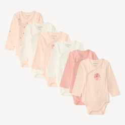 Set van 7 lange mouw baby meisjes rompertjes met verschillende afwerkingen afhankelijk van de leeftijd.