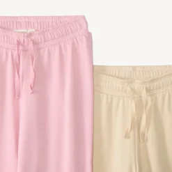 Set van 2 meisjes joggingoutfits met een sweatshirt en een wijde broek.