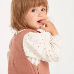 Set voor babymeisjes met een katoenen gaze jurk en een T-shirt met bloemennprint.