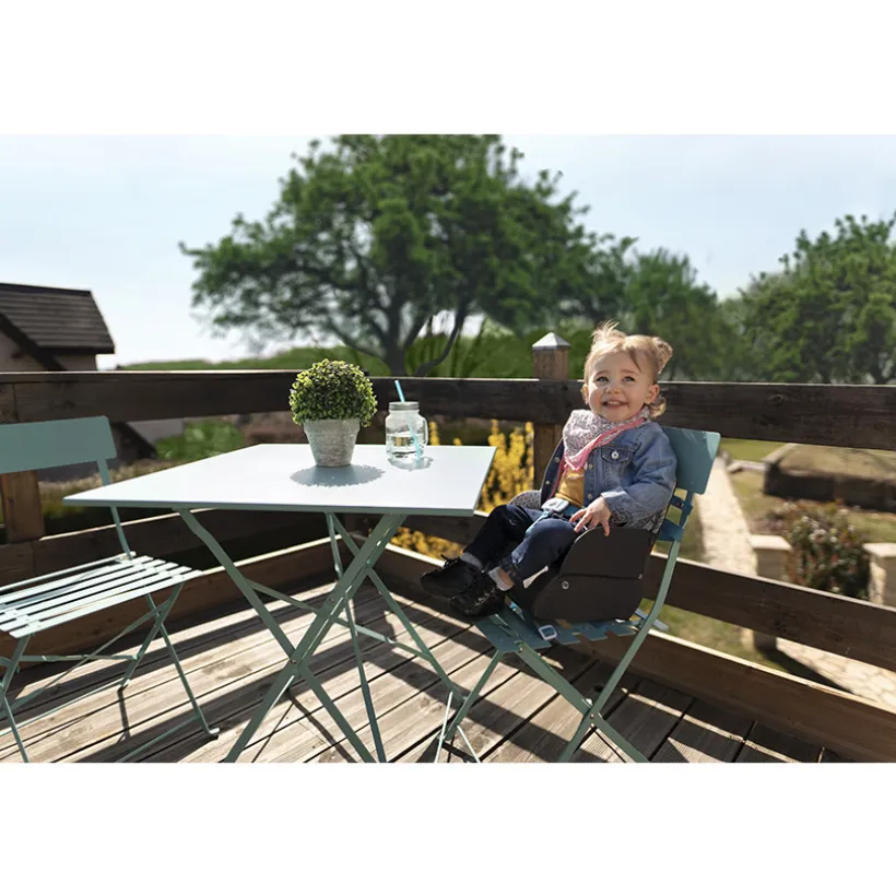 Stoelverhoger Yummy Travel met 3-punts harnas en opbergruimte