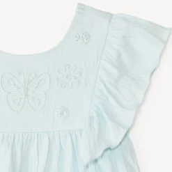 Tuniek met korte mouwen en volantjes en vlinderkoord voor meisjesbaby.