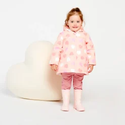 Waterafstotende rozenroze rubberparka met magische hartenprint voor babymeisje